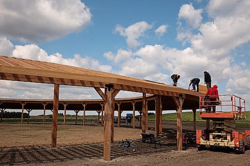 Workers with Blackbird Construction work on Rolling River First Nation’s brand new Powwow arbour in June. Rolling River’s Powwow runs from July 18-20. (Tim Smith/The Brandon Sun)