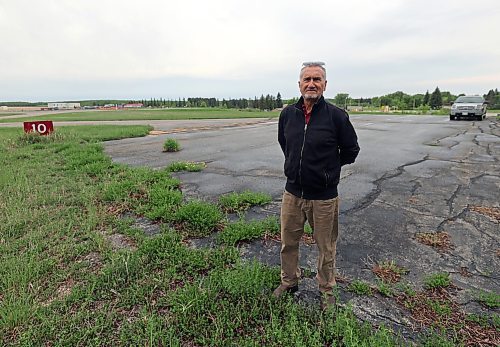 David Pedersen, a pilot who advocates for airports in the southern prairies, stands at the International Peace Garden Airport on the border with the United States. While the United States performs work on its side of the airport, Pedersen wants the province to strike a deal to expand the Canadian side into surrounding grass and bush area. Without investment, Canadian access to the airport will be lost in eight to 15 years, due to being out of date with regulations. The Canadian parking pad is seen below Pedersen's feet, and is the only infrastructure at the airport on the Canadian side of the border. (Connor McDowell/Brandon Sun)