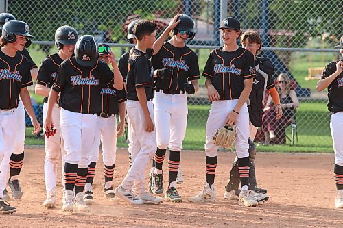 Members of the U15 AAA Brandon Marlins celebrate a home run in a home win over Oildome earlier this season. (Matt Packwood/The Brandon Sun)