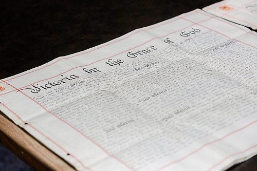 MIKE DEAL / FREE PRESS
Supplementary Charter 1884: A.37/21
The Hudson’s Bay Company Archives currently holds all nine original supplementary charters which were signed to amend the 1670 Charter of Incorporation. By the 1880s, the HBC found that its incorporating charter was inadequate for the conduct of its modern business, especially in regards to land sales. The HBC petitioned the crown for supplemental charters, the first of which was granted in 1884. The HBCA holds the original petitions to the crown for each charter. These supplementary charters, once signed, annulled the supplements and original charter that came before it. There are supplementary charters for 1884, 1892, 1912, 1920, 1949, 1957, 1960, 1963 and 1970. There are two versions of the 1970 supplementary charter, as this charter specifically made the HBC a Canadian rather than a British Company, one signed in the UK and one in Canada on May 29, 1970. All of the supplementary charters arrived at and were held by the Archives Department of the HBC in London, being received at the Archives shortly after their creation in many cases. These were all donated to the Province of Manitoba in 1994.
Reporter: Conrad Sweatman 
250610 - Tuesday, June 10, 2025.