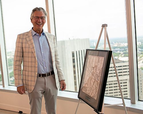 BROOK JONES/FREE PRESS
Former Manitoba Premier Gary Doer received the first ever CentrePort Canada Footprint Award during a CentrePort spring mixed at BDO Canada LLP at 201 Portage Ave. in Winnipeg, Man., June 11, 2025. Pictured: Former Manitoba Premier Gary Doer smiles while looking at the CentrePort Canada Footprint Award.