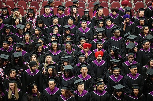 Graduates in caps and gowns wait for the commencement of the Assiniboine College graduation ceremony for the Peters School of Business and Russ Edwards School of Agriculture and Environment at Westoba Place on Friday morning. (Tim Smith/The Brandon Sun)