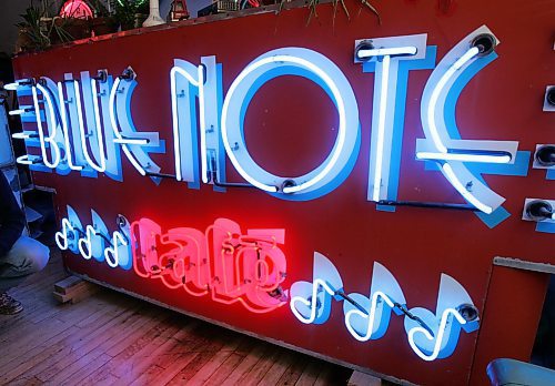 JOE BRYKSA/WINNIPEG FREE PRESS Detour- Mike Neon who owns the Neon Factory at 73 Princess St stands next to the old Blue Note Cafe sign in his sales office- Nov 01, 2005