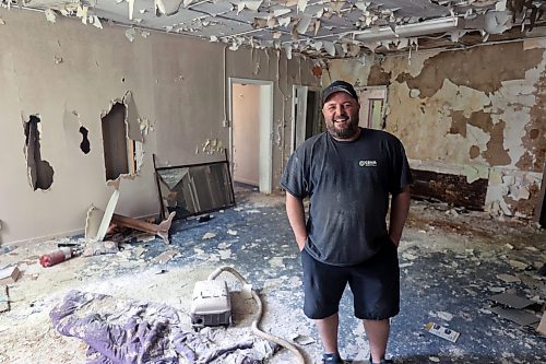 Geoff Gregoire smiles as he sees the interior of a former sanitorium, which has been vacant for decades. Gregoire and his team of tradesmen will completely gut the building, taking out everything except the bones, and then leave it to air dry for months before refurbishing the structure as apartments. (Connor McDowell/The Brandon Sun)