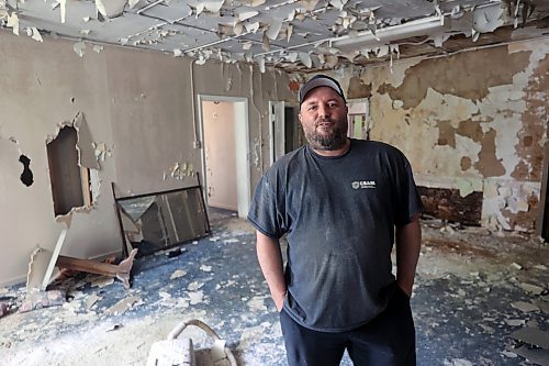 Geoff Gregoire smiles as he sees the interior of a former sanitorium, which has been vacant for decades. Gregoire and his team of tradesmen will completely gut the building, taking out everything except the bones, and then leave it to air dry for months before refurbishing the structure as apartments. (Connor McDowell/The Brandon Sun)