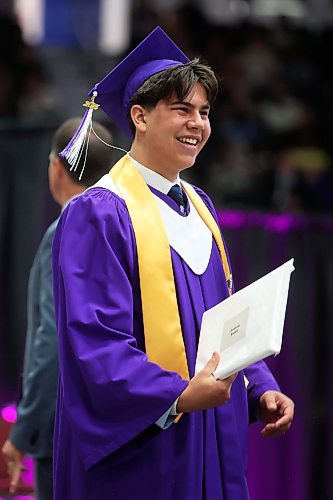 Grade 12 graduate Andrew Badea smiles after receiving his diploma during Monday’s graduation ceremony. (Tim Smith/The Brandon Sun)