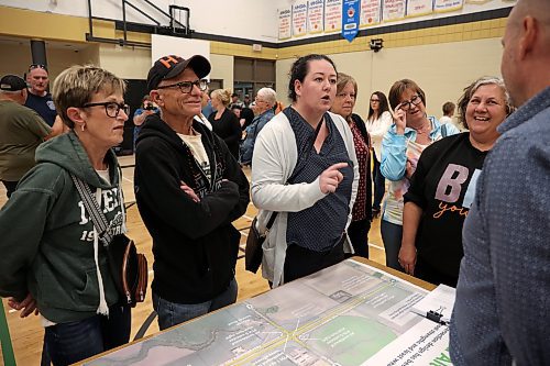 25062025
Carberry and area residents including Jordan Dickson (C) and Debra Steen (second from right), organizers of the local opposition to the proposed RCUT modification to the Trans Canada Highway at the Highway 5 intersection, voice their opposition at the fourth community engagement meeting at Carberry Collegiate on Wednesday evening. 
(Tim Smith/The Brandon Sun)
