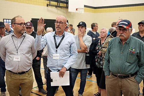 25062025
Donovan Toews, Managing Partner at Landmark Planning and Design, answers questions from concerned Carberry and area residents at the fourth community engagement meeting regarding the proposed RCUT modification to the Trans Canada Highway at the Highway 5 intersection at Carberry Collegiate on Wednesday evening.
(Tim Smith/The Brandon Sun)
