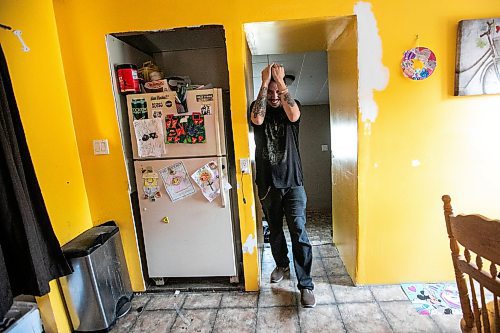 MIKAELA MACKENZIE / FREE PRESS
	
Brett Holland checks out the house after returning to his home in Flin Flon on Wednesday, June 25, 2025.

For Nicole Buffie story.
Winnipeg Free Press 2025