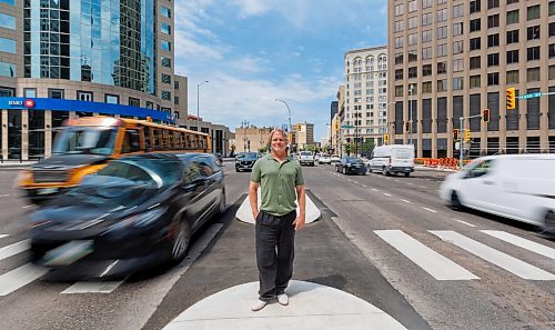 MIKE DEAL / FREE PRESS
Brent Bellamy at Portage Avenue and Main Street the day before the crosswalks are going to become active, allowing people to cross the famous intersection for the first time, legally, since 1979.
We have talked to several longtime proponents of opening Portage and Main as the iconic Winnipeg intersection prepares to welcome pedestrians Friday for the first time in nearly 50 years. Have talked to Glen Murray, Brent Bellamy, Loren Remillard and Adam Dooley. Will lead with Bellamy planning to walk across the intersection in a ‘plebiscite’ T-shirt related to the referendum during Bowman administration.
Reporter: Massimo De Luca-Taronno
250626 - Thursday, June 26, 2025.
