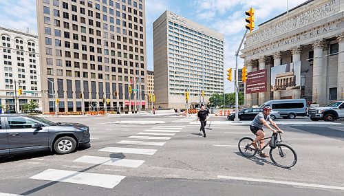 MIKE DEAL / FREE PRESS
A cyclist and pedestrian use the crosswalks despite the lights not working yet.
Brent Bellamy at Portage Avenue and Main Street the day before the crosswalks are going to become active, allowing people to cross the famous intersection for the first time, legally, since 1979.
We have talked to several longtime proponents of opening Portage and Main as the iconic Winnipeg intersection prepares to welcome pedestrians Friday for the first time in nearly 50 years. Have talked to Glen Murray, Brent Bellamy, Loren Remillard and Adam Dooley. Will lead with Bellamy planning to walk across the intersection in a &#x2018;plebiscite&#x2019; T-shirt related to the referendum during Bowman administration.
Reporter: Massimo De Luca-Taronno
250626 - Thursday, June 26, 2025.