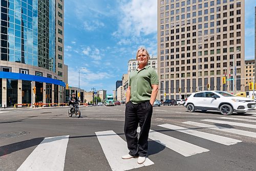 MIKE DEAL / FREE PRESS
Brent Bellamy at Portage Avenue and Main Street the day before the crosswalks are going to become active, allowing people to cross the famous intersection for the first time, legally, since 1979.
We have talked to several longtime proponents of opening Portage and Main as the iconic Winnipeg intersection prepares to welcome pedestrians Friday for the first time in nearly 50 years. Have talked to Glen Murray, Brent Bellamy, Loren Remillard and Adam Dooley. Will lead with Bellamy planning to walk across the intersection in a ‘plebiscite’ T-shirt related to the referendum during Bowman administration.
Reporter: Massimo De Luca-Taronno
250626 - Thursday, June 26, 2025.