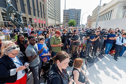 MIKE DEAL / FREE PRESS
Several hundred members of the public and a full phalanx of media during the opening speeches.
The day of the official opening of the pedestrian crosswalks at the historic intersection of Portage Avenue and Main Street started with crews clearing away the last of the barriers and impatient people crossing despite those barriers.
The Mayor, Scott Gillingham and several city council members, along with may of the stakeholders for the buildings at each of the corners of the intersection were on hand with several hundred members of the public who cam to cheer and be some of the first to cross after the opening.
Dancing Gabe was on hand to lead a huge crowd around each of the intersections.
Reporter: Tyler Searle
250627 - Friday, June 27, 2025.