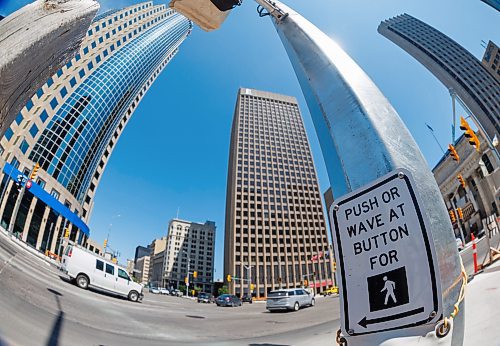 MIKE DEAL / FREE PRESS
The intersection of Portage Avenue and Main Street days before it’s set to open up pedestrian crosswalks.
250620 - Friday, June 20, 2025.
