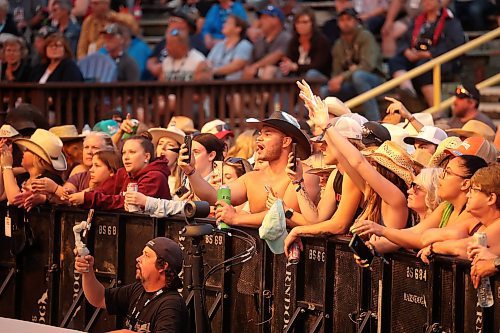 Fans watch as Jackson Dean performs with his band on the main stage at Dauphin’s Countryfest 2025 on Friday evening. (Tim Smith/The Brandon Sun)