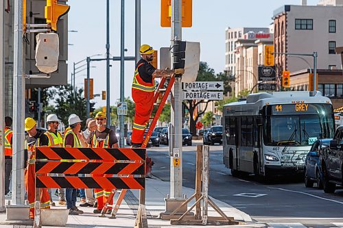 MIKE DEAL / FREE PRESS
The day of the official opening of the pedestrian crosswalks at the historic intersection of Portage Avenue and Main Street started with crews clearing away the last of the barriers and impatient people crossing despite those barriers.
The Mayor, Scott Gillingham and several city council members, along with may of the stakeholders for the buildings at each of the corners of the intersection were on hand with several hundred members of the public who cam to cheer and be some of the first to cross after the opening.
Dancing Gabe was on hand to lead a huge crowd around each of the intersections.
Reporter: Tyler Searle
250627 - Friday, June 27, 2025.