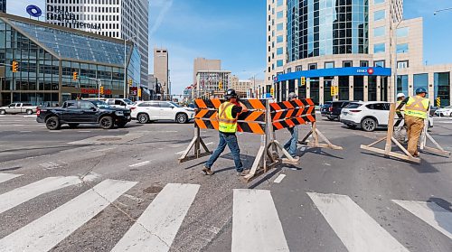 MIKE DEAL / FREE PRESS
The day of the official opening of the pedestrian crosswalks at the historic intersection of Portage Avenue and Main Street started with crews clearing away the last of the barriers and impatient people crossing despite those barriers.
The Mayor, Scott Gillingham and several city council members, along with may of the stakeholders for the buildings at each of the corners of the intersection were on hand with several hundred members of the public who cam to cheer and be some of the first to cross after the opening.
Dancing Gabe was on hand to lead a huge crowd around each of the intersections.
Reporter: Tyler Searle
250627 - Friday, June 27, 2025.