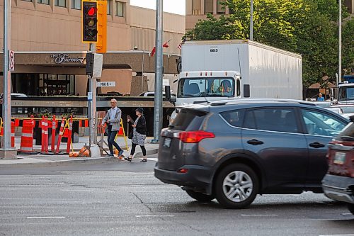 MIKE DEAL / FREE PRESS
The day of the official opening of the pedestrian crosswalks at the historic intersection of Portage Avenue and Main Street started with crews clearing away the last of the barriers and impatient people crossing despite those barriers.
The Mayor, Scott Gillingham and several city council members, along with may of the stakeholders for the buildings at each of the corners of the intersection were on hand with several hundred members of the public who cam to cheer and be some of the first to cross after the opening.
Dancing Gabe was on hand to lead a huge crowd around each of the intersections.
Reporter: Tyler Searle
250627 - Friday, June 27, 2025.