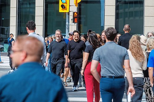 MIKE DEAL / FREE PRESS
Once crossing the street at Portage and Main became official huge crowds of people make their way around to each of the crosswalks.
The day of the official opening of the pedestrian crosswalks at the historic intersection of Portage Avenue and Main Street started with crews clearing away the last of the barriers and impatient people crossing despite those barriers.
The Mayor, Scott Gillingham and several city council members, along with may of the stakeholders for the buildings at each of the corners of the intersection were on hand with several hundred members of the public who cam to cheer and be some of the first to cross after the opening.
Dancing Gabe was on hand to lead a huge crowd around each of the intersections.
Reporter: Tyler Searle
250627 - Friday, June 27, 2025.