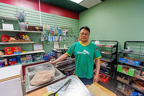 MIKE DEAL / FREE PRESS
While the celebration was taking place above ground, Eric Chi, owner of the convenience story Eshel Tree, in the underground concourse was hard at work getting ready for pedestrians that may want to stop by for some of his Korean snacks.
The day of the official opening of the pedestrian crosswalks at the historic intersection of Portage Avenue and Main Street started with crews clearing away the last of the barriers and impatient people crossing despite those barriers.
The Mayor, Scott Gillingham and several city council members, along with may of the stakeholders for the buildings at each of the corners of the intersection were on hand with several hundred members of the public who cam to cheer and be some of the first to cross after the opening.
Dancing Gabe was on hand to lead a huge crowd around each of the intersections.
Reporter: Tyler Searle
250627 - Friday, June 27, 2025.