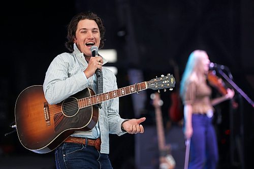 27062025
Drake Milligan of Texas performs for the crowd with his band on the main stage at Dauphin&#x2019;s Countryfest 2025 south of Dauphin, Manitoba on a hot Friday evening. 
(Tim Smith/The Brandon Sun)