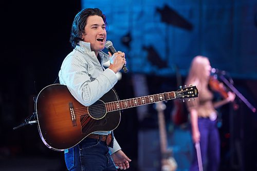 27062025
Drake Milligan of Texas performs for the crowd with his band on the main stage at Dauphin&#x2019;s Countryfest 2025 south of Dauphin, Manitoba on a hot Friday evening. 
(Tim Smith/The Brandon Sun)