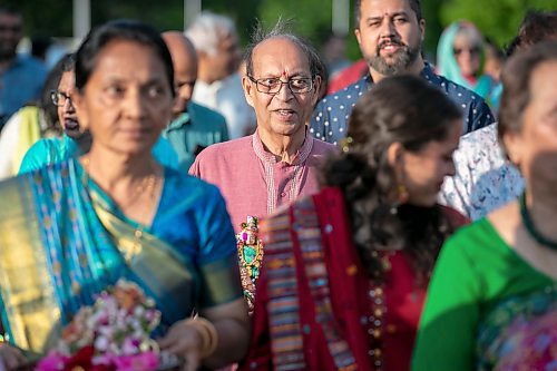 BROOK JONES/FREE PRESS
Community members celebrate the 20th anniversary of the Hindu Temple &amp; Dr. Raj Pandey Hindu Centre at 999 St. Anne's Rd. in Winnipeg, Man., Thursday, June 26, 2025. Pictured: Raj Pandey (middle) who is a former trustee with the Hindu Society of Manitoba and the largest finanical donor for the Hindu Temple &amp; Dr. Raj Pandey Hindu Centre joins community members in a procession around the temple called Parikrama where people walk clockwise around a sacred place.