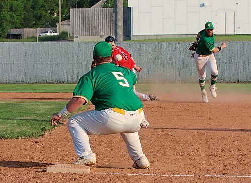 Brandon Young Guns first baseman Jason Rae (5) prepares to catch a double play throw from Garrett Popplestone, right, as Hamiota Red Sox base runner Justin Knight (11) looks on during South West Baseball League action at Andrews Field on Wednesday evening. Stevenson was judged to be safe. (Perry Bergson/The Brandon Sun)
July 2, 2025