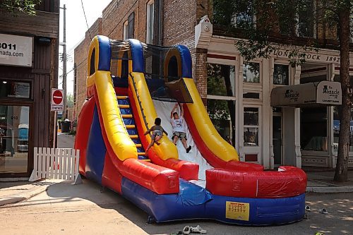 02072025
Kids play on a bouncy slide during the Downtown Summer Market on Rosser Avenue in Brandon on Wednesday afternoon. The market, organized by the Brandon Downtown Biz, featured local vendors, entertainment and games, food and other attractions. The afternoon/evening market will run every Wednesday on Rosser Avenue between 9th Street and 10th Street from July to September.
(Tim Smith/The Brandon Sun)