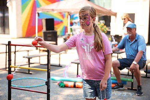 02072025
Ten-year-old Tryss Juri of Brandon plays ladder golf during the Downtown Summer Market on Rosser Avenue in Brandon on Wednesday afternoon. The market, organized by the Brandon Downtown Biz, featured local vendors, entertainment and games, food and other attractions. The afternoon/evening market will run every Wednesday on Rosser Avenue between 9th Street and 10th Street from July to September.
(Tim Smith/The Brandon Sun)
