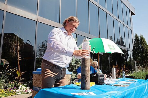 04072025
Brandon Mayor Jeff Fawcett unveils the contents of the Brandon 2000 Millennium Time Capsule, which was buried in a garden outside Brandon City Hall 25 years ago, to a crowd outside city hall on Friday morning. The time capsule was created by the United Commercial Travelers (UCT) as part of Brandon City Council’s call-out for local organizations to create ways to celebrate the millennium.
(Tim Smith/The Brandon Sun)