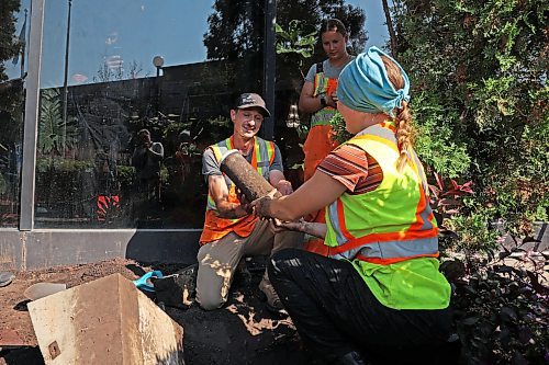 04072025
City of Brandon workers dig up the Brandon 2000 Millennium Time Capsule, which was buried in a garden outside Brandon City Hall 25 years ago. The time capsule was created by the United Commercial Travelers (UCT) as part of Brandon City Council’s call-out for local organizations to create ways to celebrate the millennium. Brandon Mayor Jeff Fawcett opened the capsule and unveiled the contents to the crowd at city hall. (Tim Smith/The Brandon Sun)