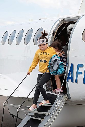 04072025
Evacuees from Lynn Lake, Manitoba step off a plane at the Brandon Municipal Airport on Friday afternoon after being evacuated from Lynn Lake due to wildfires threatening the community. This is the second time this summer that Lynn Lake has been evacuated. (Tim Smith/The Brandon Sun