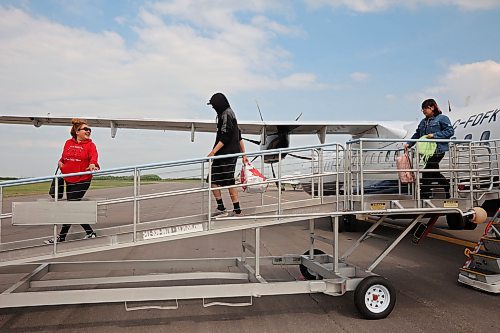 04072025
Evacuees from Lynn Lake, Manitoba arrive at the Brandon Municipal Airport on Friday afternoon after being evacuated from Lynn Lake due to wildfires threatening the community. This is the second time this summer that Lynn Lake has been evacuated. (Tim Smith/The Brandon Sun