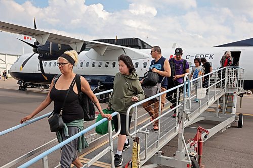 04072025
Evacuees from Lynn Lake, Manitoba arrive at the Brandon Municipal Airport on Friday afternoon after being evacuated from Lynn Lake due to wildfires threatening the community. This is the second time this summer that Lynn Lake has been evacuated. (Tim Smith/The Brandon Sun