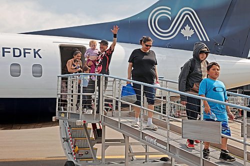 04072025
Evacuees from Lynn Lake, Manitoba arrive at the Brandon Municipal Airport on Friday afternoon after being evacuated from Lynn Lake due to wildfires threatening the community. This is the second time this summer that Lynn Lake has been evacuated. (Tim Smith/The Brandon Sun