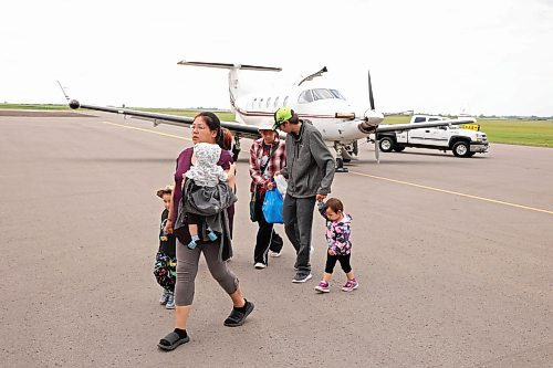 04072025
Nikita Moose, Trent Farrow and their seven children arrive at the Brandon Municipal Airport on Friday afternoon after being evacuated from Lynn Lake, Manitoba due to wildfires threatening the community. This is the second time this summer that Lynn Lake has been evacuated. (Tim Smith/The Brandon Sun