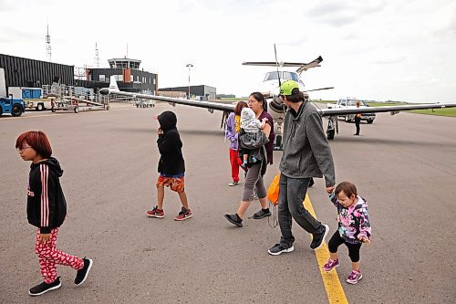 04072025
Nikita Moose, Trent Farrow and their seven children arrive at the Brandon Municipal Airport on Friday afternoon after being evacuated from Lynn Lake, Manitoba due to wildfires threatening the community. This is the second time this summer that Lynn Lake has been evacuated. (Tim Smith/The Brandon Sun