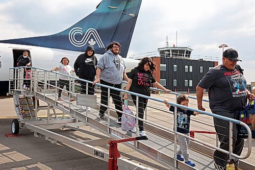 04072025
Evacuees from Lynn Lake, Manitoba arrive at the Brandon Municipal Airport on Friday afternoon after being evacuated from Lynn Lake due to wildfires threatening the community. This is the second time this summer that Lynn Lake has been evacuated. (Tim Smith/The Brandon Sun