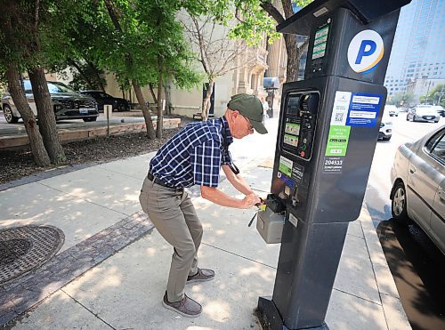 Ruth Bonneville / Free Press
Local Parking pay stations
A worker with the City of Wpg. Removes the cash box at a pay station Tuesday. (No name provided).
Story about all pay stations being permanently removed. Drivers wanting to park on city roads will have to use phone app to pay for their parking moving forward.
Story Maddison
July 8th, 2025