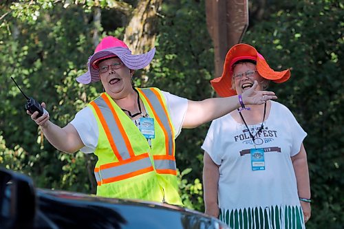Winnipeg Folk Fest 2014 . A hardy welcome to the Folk Festival was given to visitors arriving at the camp ground by volunteers LtoR Jeanne Harrison and Denise de Decker. The day began with the drive or bike ride to the park , hundreds of participants rode their bikes to the Birds Hill Park to get priority entry to the event . Thousands of cars , trucks and RV's rolled directly into the park to the camp ground parking streamlining delays of previous years . July 9 2014 / KEN GIGLIOTTI / WINNIPEG FREE PRESS