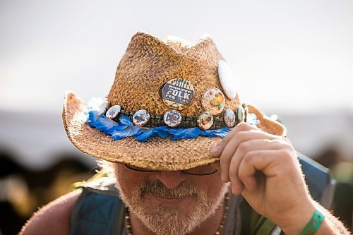 MIKAELA MACKENZIE / FREE PRESS
	
Todd Angus shows off his hat, with buttons from over the years, at Folk Fest on Thursday, July 10, 2025. 

For folk fest story.
Winnipeg Free Press 2025