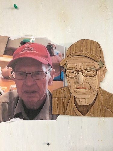 A side-by-side comparison of a photo of Fraser Moffat, a late resident of Strathclair, and a crafted picture of him using oak, walnut and maple wood. Harold Hogg spends about two weeks of work on each piece. (Connor McDowell/The Brandon Sun)