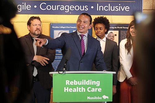 Premier Wab Kinew laughs while sparring with a reporter over the vacant Spruce Woods riding seat after an announcement at Brandon University’s Brodie Science Centre on Wednesday. (Tim Smith/The Brandon Sun)