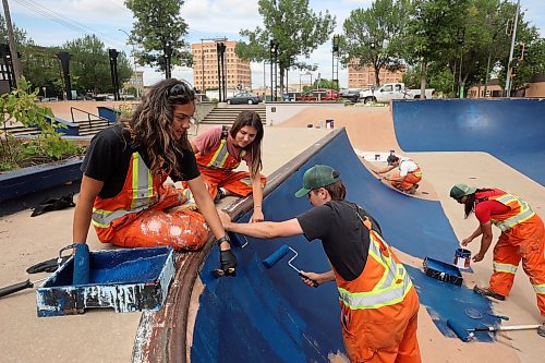 16072025
City of Brandon Parks and Recreation workers paint the bowl at the Kristopher Campbell Memorial Skate Plaza in downtown Brandon on Wednesday. The workers have been painting all the ledges, banks and transitions in preparation for the Skatepark Graffiti Jam event scheduled for the plaza on August 2nd. The event, presented by the City of Brandon and Brandon Downtown Biz will feature music, food, skateboarding and graffiti artists creating murals within the skatepark.
(Tim Smith/The Brandon Sun)