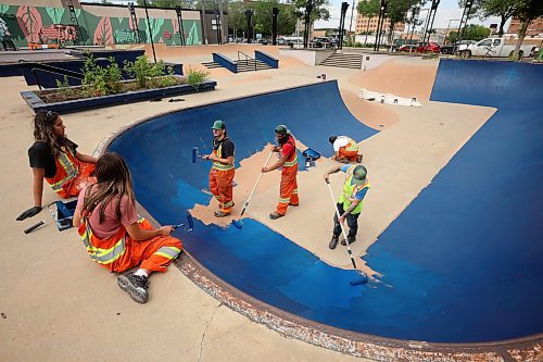 16072025
City of Brandon Parks and Recreation workers paint the bowl at the Kristopher Campbell Memorial Skate Plaza in downtown Brandon on Wednesday. The workers have been painting all the ledges, banks and transitions in preparation for the Skatepark Graffiti Jam event scheduled for the plaza on August 2nd. The event, presented by the City of Brandon and Brandon Downtown Biz will feature music, food, skateboarding and graffiti artists creating murals within the skatepark. 
(Tim Smith/The Brandon Sun)