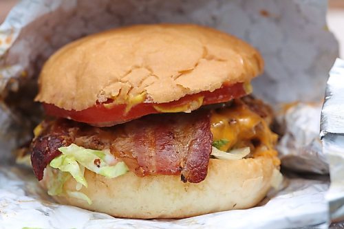 A bacon cheeseburger with "the works" at The Dairy Bar in Souris is a favourite with the owner. The burger is packed with cheese and bacon, and the beef is sourced from a cattle operation just outside of town. (Matt Goerzen/The Brandon Sun)