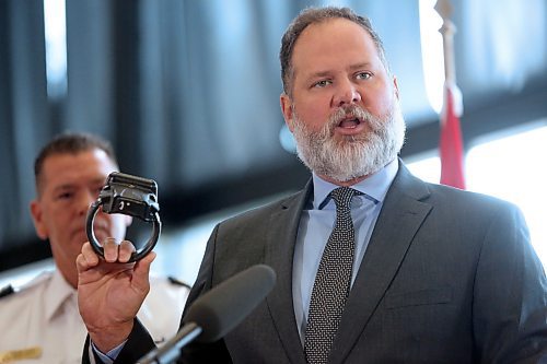 Manitoba Justice Minister Matt Wiebe holds up an ankle monitor during a Thursday morning press conference in which he announced $1.2 million in new spending to add up to 100 more ankle minors to track offenders released on bail. (Matt Goerzen/The Brandon Sun)