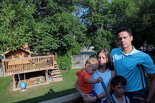 Chris Bird, Courtney Snider and their two sons Ryker, 6, and Liam, 1, are seen in their backyard. Across the street, a property has been proposed for a 35-metre tall cell tower. The father has started a petition to stop the tower, and introduce guidelines to Brandon so that towers avoid areas next to houses. (Connor McDowell/Brandon Sun)