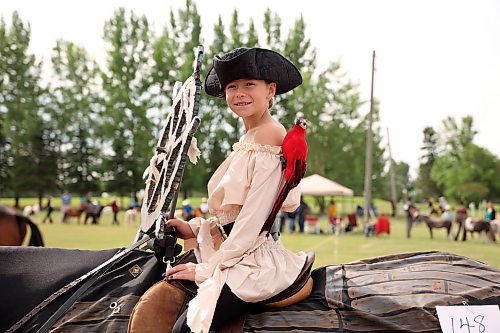 Leah Miskiman of Rocanville, Sask., waits with her horse, Dundee, to compete in a costume class at the Hamiota Fair on Thursday. Miskiman placed first in the class. The fair included a breakfast, parade, livestock shows, Gymkhana rodeo, all sorts of games, activities and food, and a variety of other events. (Tim Smith/The Brandon Sun)